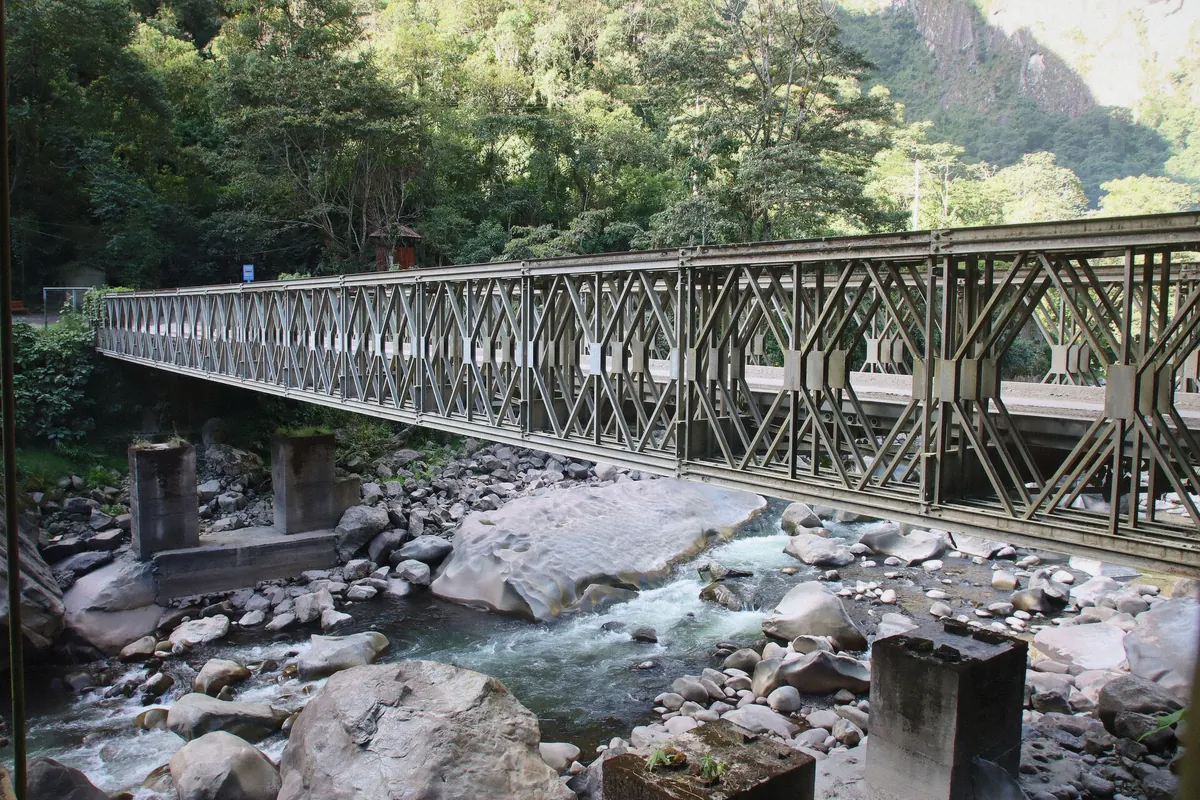 The Aguas Calientes valley with buildings tucked under the cloud forest ridge in Peru