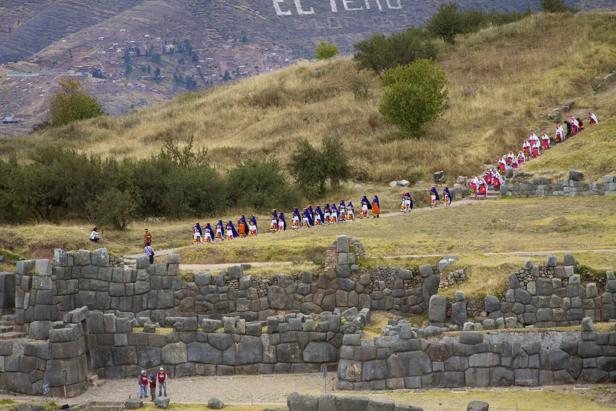 Dancers in festival dress at the Inti Raymi solstice celebration in Cusco, Peru