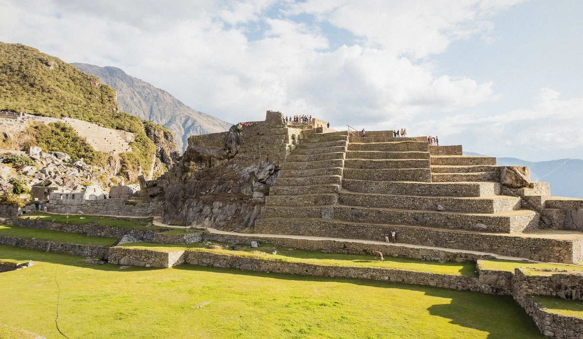 Upper agricultural terraces of Machu Picchu with the Huayna Picchu ridge behind, Peru