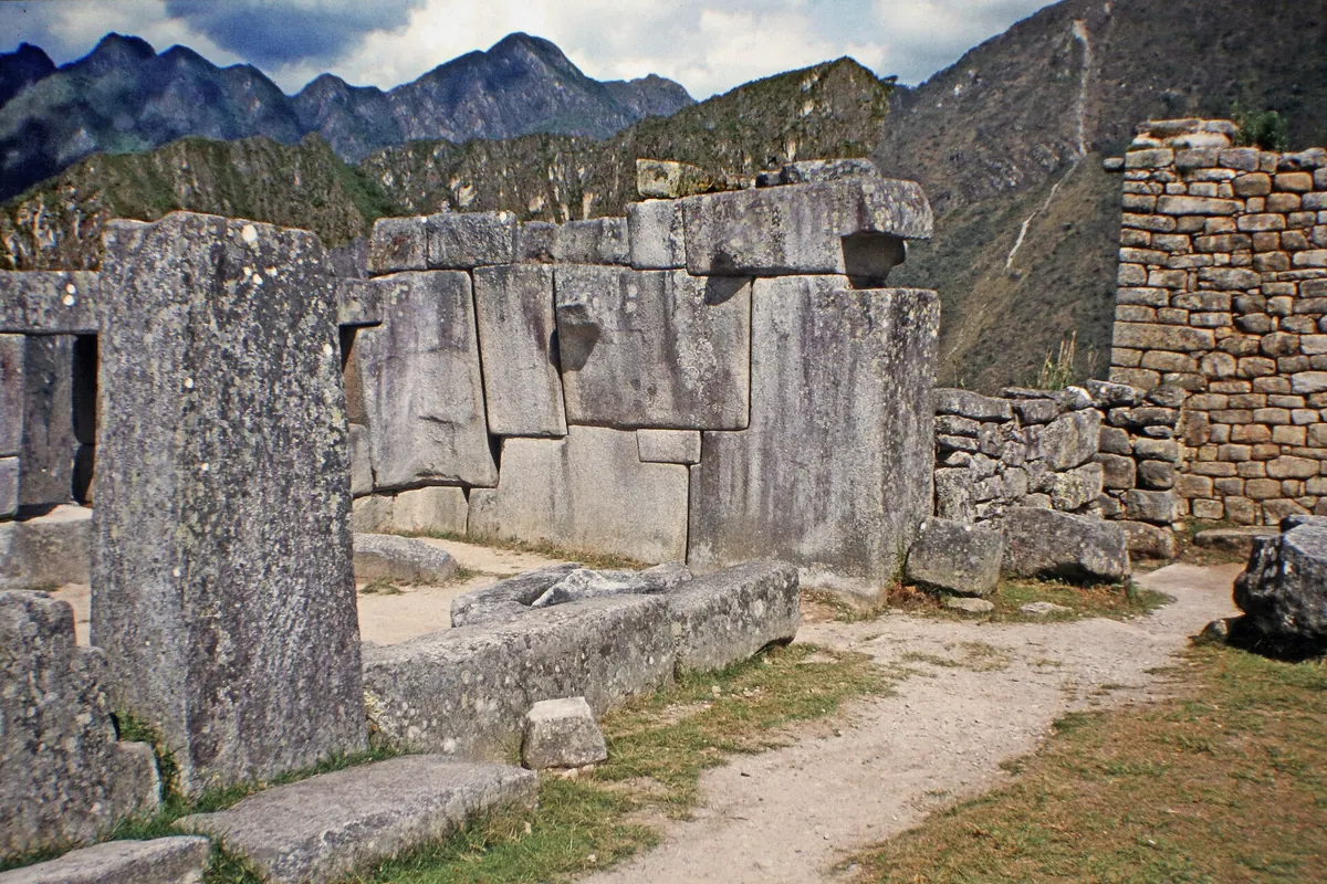 Overlooking the central plaza of Machu Picchu with Huayna Picchu rising behind in Peru