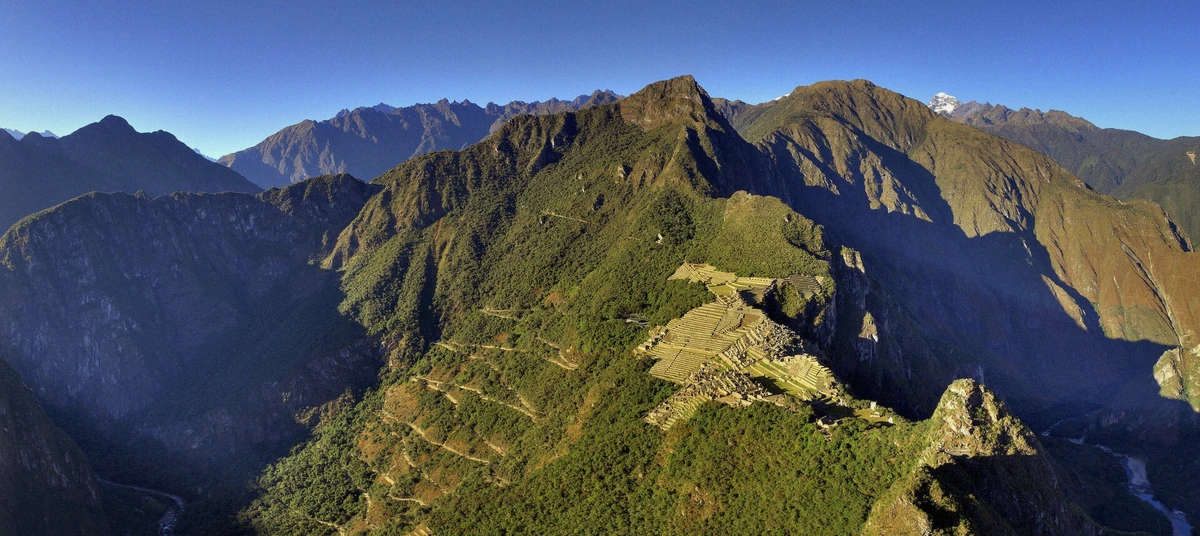 Terraces of Machu Picchu at early morning with the ridge still in shadow, Peru