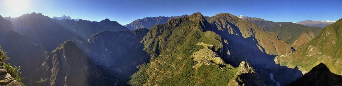 Machu Picchu terraces emerging from cloud at dawn in the Cusco Region of Peru
